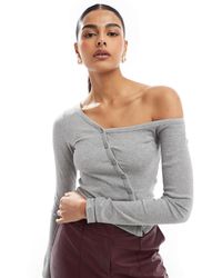 Stradivarius - Str Asymmetric Buttoned Jersey Top - Lyst