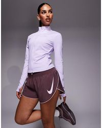 Nike - Tempo Dri-fit Mid Rise Swoosh Shorts - Lyst