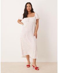 Nobody's Child - Raven - robe mi-longue à pois avec manches bouffantes - et rouge - Lyst