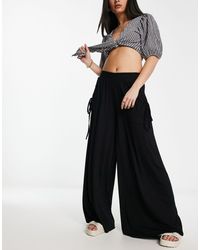 ASOS - Pantaloni a fondo ampio neri con tasche e vita arricciata - Lyst