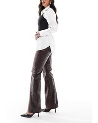 ASOS - Minimalistische Elegante Flare-Broek Van Imitatieleer Met Slangenprint - Lyst
