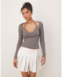 ASOS - Geribbelde Top Met Halternek En Lange Mouwen - Lyst