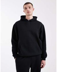 ASOS - Sudadera Negra Básica Holgada Con Capucha Essentials De - Lyst