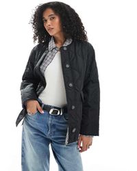 Vero Moda - Giacca Corta Trapuntata A Cipolla Nera Con Tasche - Lyst