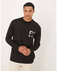 ASOS - T-Shirt A Maniche Lunghe Nera Con Stampa Di Fiore Piccolo Sul Petto - Lyst