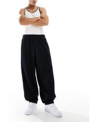 Nike - Club French Terry Oversized joggers - Lyst