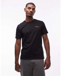 Timberland - T-Shirt Nera Con Scritta Piccola Del Logo Sul Petto - Lyst