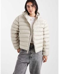 New Balance - Sport Essentials Hooded Puffer Jacket - Lyst