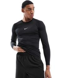 Nike - Nike – training pro – langärmliges, körperbetontes t-shirt - Lyst