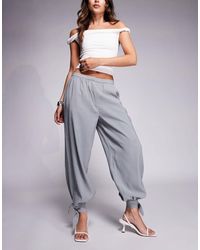 ASOS - Pantalon ajusté décontracté noué aux chevilles - gris clair - Lyst