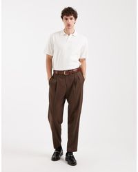 ASOS - Elegante Ruimvallende Toelopende Broek Van Premium Wolmix Met Plooien - Lyst