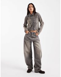 Collusion - – figurbetonte, beflockte jeansjacke mit kontrastnähten - Lyst
