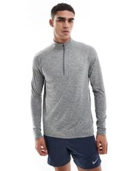 Nike - Stride - top à manches longues et col zippé en tissu dri-fit - Lyst