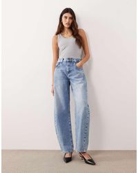 ARRANGE - Tova Tapered Curved Leg Jean With Roll Hem - Lyst