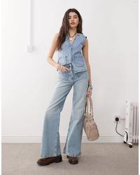Reclaimed Vintage - – palazzo-jeans im stil der 70er mit aufgesetzten taschen und knopfverschluss - Lyst