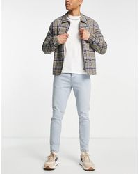 TOPMAN - Vaqueros Elásticos Con Lavado Claro Tintado De Corte Tapered De -Azul - Lyst