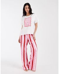 Loungeable - 'Leave By 9Pm' Graphic T-Shirt And Jersey Trouser Pyjama Set - Lyst