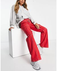 ASOS - Pantaloni a zampa stile cargo con cintura rossi - Lyst