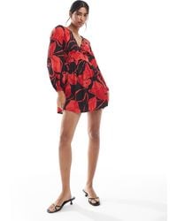 Wednesday's Girl - Bold Bloom V-neck Mini Dress - Lyst