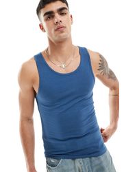 ASOS - Camiseta ajustada sin mangas en azul - Lyst