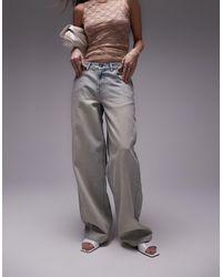 TOPSHOP - Jeans con cinturino sul retro lavaggio candeggiato sporco - Lyst