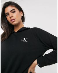 Calvin Klein – CK One – Lounge – er Kapuzenpullover mit Logo - Schwarz