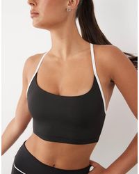 4505 - Active Light Support Sports Bra With Piping And Removable Padding - Lyst
