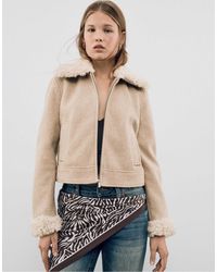 Stradivarius - Veste avec détail en fausse fourrure - écru - Lyst