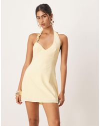 SNDY'S - Robe courte aspect lin à dos nu et détails métalliques - citron - Lyst