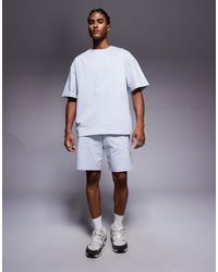 River Island - Conjunto De Pantalones Cortos Y Camiseta Con Diseño Estampado De - Lyst