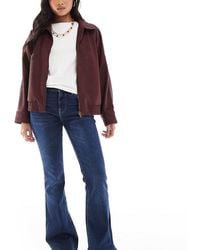 Bershka - Petite High Waisted Flared Jeans - Lyst