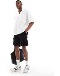 Bershka - Pantaloncini Cargo Neri - Lyst