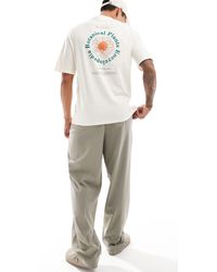 SELECTED - T-shirt oversize color crema con stampa botanica circolare sulla schiena - Lyst
