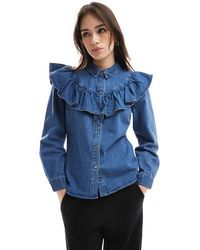 ONLY - Camisa Vaquera De Manga Larga Con Lavado Azul Medio Y Volante De - Lyst