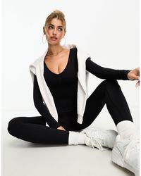 Missy Empire - Seamless Long Sleeve Plunge Jumpsuit - Lyst