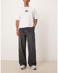 ASOS - – sehr weite jeans mit faltendetails und waschung - Lyst