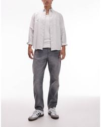Carhartt - Newel Relaxed Tapered Fit Jeans - Lyst