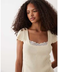 Miss Selfridge - Knitted Peplum Top With Lace Trim - Lyst