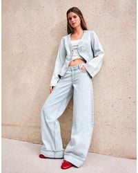 Bershka - Jeans Met Wijde Pijpen, Lage Taille En Omslag - Lyst