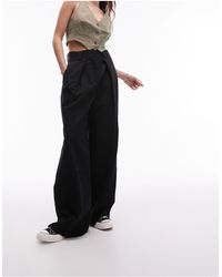 TOPSHOP - Pantalon large ajusté avec pinces sur l'ourlet - Lyst