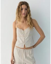 Pull&Bear - Crop top à fines bretelles bordé - Lyst