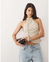 Motel - Top Asimétrico Con Botones Y Cuello Alto En Rayas-Dorado - Lyst
