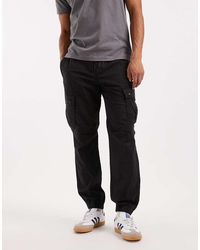 River Island - Pantalones Negros Cargo De Corte Estándar De - Lyst
