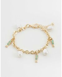 ASOS - Bracelet avec breloques poissons et perles fantaisie - doré - Lyst