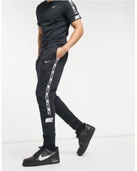 nike gel tape cuffed track pants