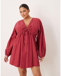 ASOS - Asos design curve - robe courte en velours côtelé à col v nouée sur le buste avec manches volumineuses - bordeaux délavé - Lyst