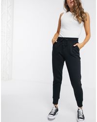 Converse Track pants and sweatpants for Women - Lyst.com