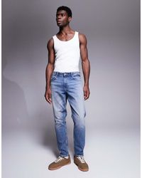 ASOS - Jeans Affusolati Lavaggio Chiaro Vintage - Lyst