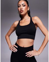 ASOS - Seamless Multi Strap Medium Support Sports Bra With Removable Padding - Lyst