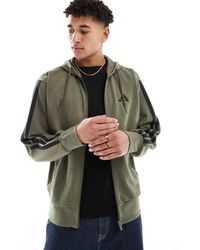 adidas Originals - Sudadera Verde Oliva Con Capucha, Detalle De 3 Rayas Negras Y Cremallera De Felpa De Rizo De Adidas Essentials - Lyst